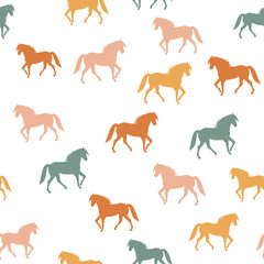 Obraz premium Seamless pattern with colorful walking horses silhouettes on white background. Vector illustration for baby, kids textile, fabric. EPS 10