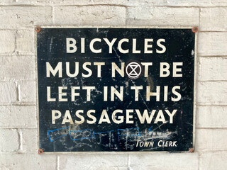 no bicycles sign on the wall