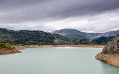 Barrios de Luna reservoir, mountains and cloudy sky. Province of León, Spain.