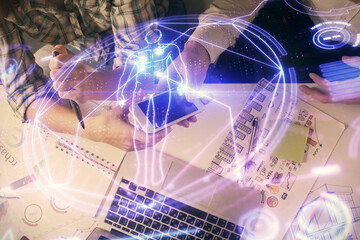 Double exposure of education theme drawing and man and woman working together holding and using a mobile device.