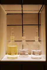 Glass bottles of different shapes with colorful liquids