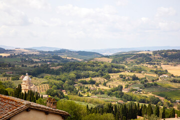 Fototapeta na wymiar Montepulciano (SI), Italy - August 02, 2021: View of the hills from Montepulciano town, Tuscany, Italy