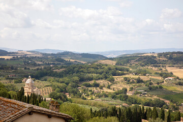 Fototapeta na wymiar Montepulciano (SI), Italy - August 02, 2021: View of the hills from Montepulciano town, Tuscany, Italy