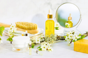 bathroom accessories, natural cosmetic product, serum, massage, aroma, essential oil in glass bottle with pipette on marble background. brush for dry massage, anti cellulite, stretch marks, wrinkles