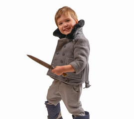 A boy in a coat with a sword in his hands. Place for text