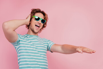 Cheerful carefree dj enjoy give performance imagine headphones track wear sunglass