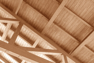 Wooden roof construction. Part of the floor of a wooden house.