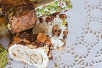 traditional Turkish sweets, baklava, lies on a beautiful napkin on the table. Treats, delicacies,...