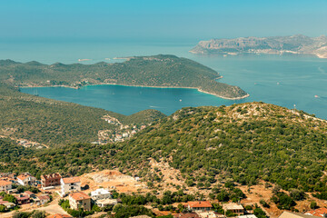 Top view of the green hills of the Kas peninsula, the blue bay and the Greek island of Kastelorizo