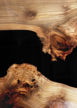 sawing wood karagach drenched in black resin