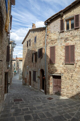 Fototapeta na wymiar Castiglione d' Orcia (SI), Italy - August 10, 2021: Castiglione d' Orcia village and houses view, Tuscany, Italy
