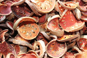 Dried bael fruit background. Close up dried herb. Many of slices of bael fruit .