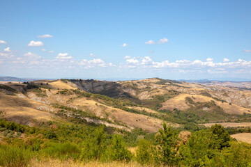Fototapeta premium Val d' Orcia (SI), Italy - August 05, 2021: Typical landscape in val d' Orcia, Tuscany, Italy