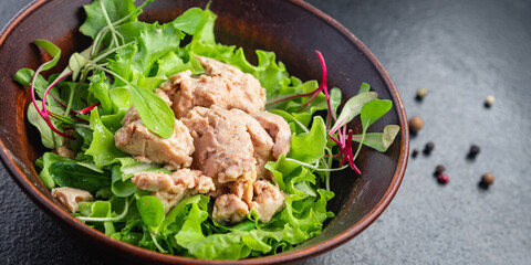 Cod liver salad mix petals lettuce leaves fish fat seafood omega-3 vitamin aperitif fresh meal snack on the table copy space food background keto or paleo diet veggi vegetarian pescetarian diet