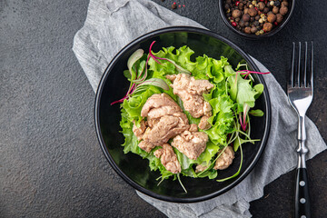 Cod liver salad mix petals lettuce leaves fish fat seafood omega-3 vitamin aperitif fresh meal snack on the table copy space food background keto or paleo diet veggi vegetarian pescetarian diet