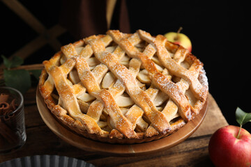 Delicious traditional apple pie on wooden stand