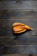 Ugly vegetables on a wooden background. Carrot. agricultural problems. Top view. 
