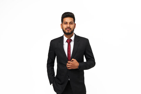 Portrait of young indian top manager in black suit on white isolated background