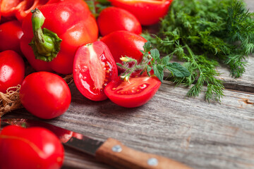 Fresh vegetables, sweet tomatoes and bell peppers on wooden background. Organic food