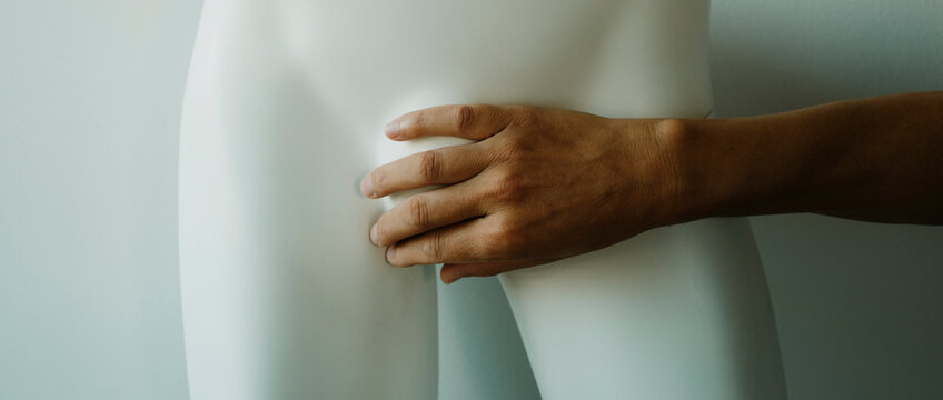 man covers the mannequins crotch, we banner