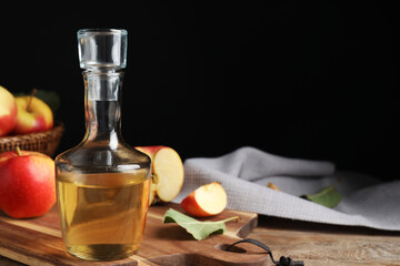 Natural apple vinegar and fresh fruits on wooden table. Space for text