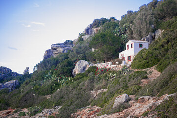 Fototapeta na wymiar historic white mediterranean hillside villa cozy decorated with blooming cacti