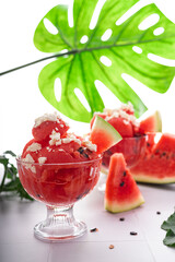 Sweet ripe summer watermelon on slices and as a dessert in a cup with feta cheese