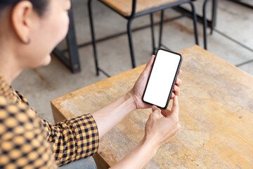 cell phone blank white screen mockup.hand holding texting using mobile on desk at office.background empty space for advertise.work people contact marketing business,technology