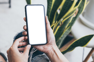 cell phone blank white screen mockup.hand holding texting using mobile on desk at office.background empty space for advertise.work people contact marketing business,technology