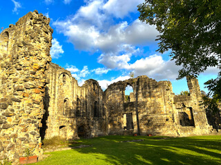 Fototapeta na wymiar Late autumn scene, with old Abbey ruins, on a sunny evening in, Leeds, Yorkshire, UK