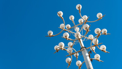 old street lamp on blue sky background