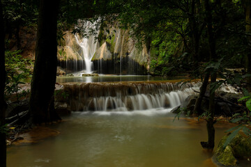 Fototapeta premium Beautiful waterfall and a swaying stream at Muaklek, Saraburi, THAILAND