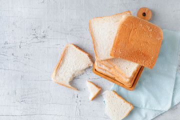 Bread slides on white wooden background