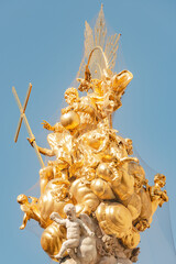 Top golden baroque sculptures of Column of Holy Trinity which commemorate victims of the plague...