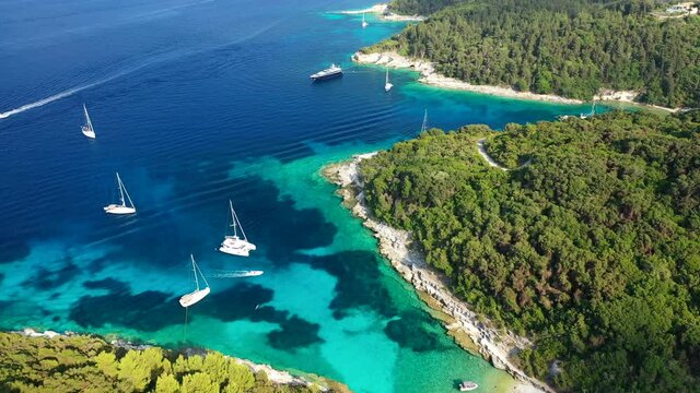 Aerial drone video of tropical paradise turquoise bay and sandy beach in popular Mediterranean destination island