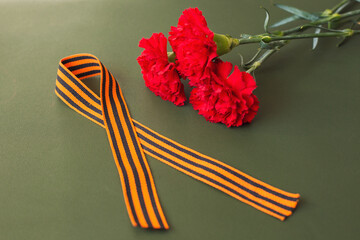 9th May. red carnations and St. George ribbon. free space for text
