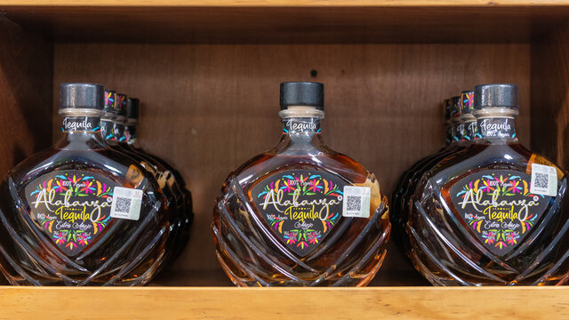 Bottles of Alabanza Tequila in a store shelf in Mexico