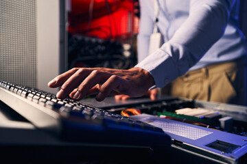 Professional IT technician setting up network server
