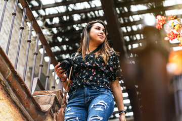 latina woman entering a restaurant