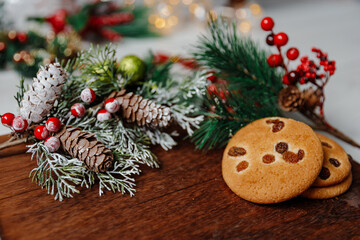 Festive Christmas and new year card with cookie on dark wooden background