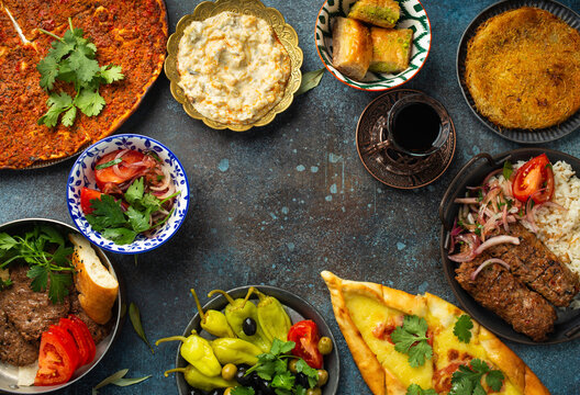 Traditional Turkish dishes and mezze - Pide, Lahmacun, meat kebab, Turkish meatballs, sweet baklava and K�nefe