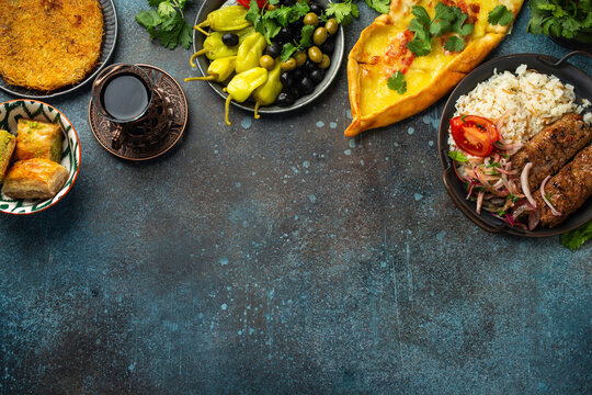 Traditional Turkish dishes and mezze - Pide, Lahmacun, meat kebab, Turkish meatballs, sweet baklava and K�nefe