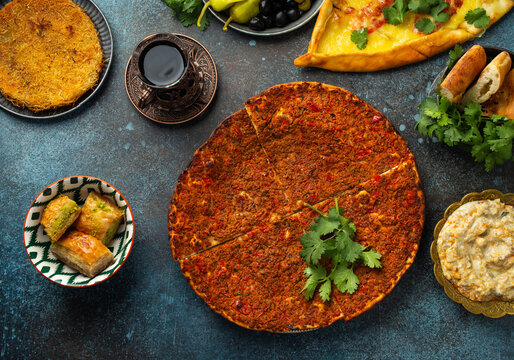 Lacmacun - traditional Turkish pizza made of dough with minced meat, vegetables and herbs topping