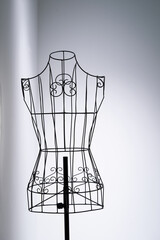 Stylish wire tailor's mannequin isolated on white