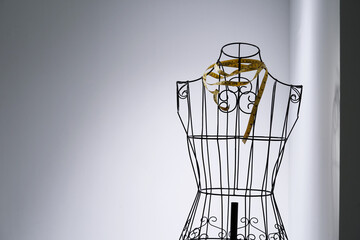 Stylish wire tailor's mannequin isolated on white