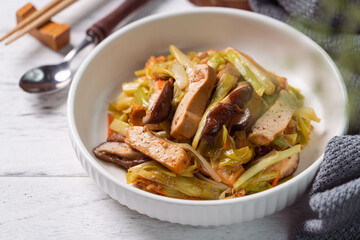 Homemade stir-fried dried beancurd with leek sprouts.