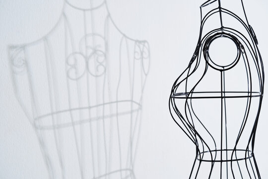 Stylish wire tailor's mannequin with shadow