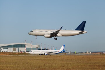 Fototapeta na wymiar Airplane taking off the runway from the airport