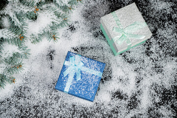 Decorative red Christmas gift in winter snow for your seasonal greeting.