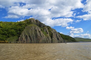 Fototapeta na wymiar Auri cliff on the Amur river. Natural monument and sacral place of worship of the indigenous peoples of the North. Khabarovsk Krai, far East, Russia.